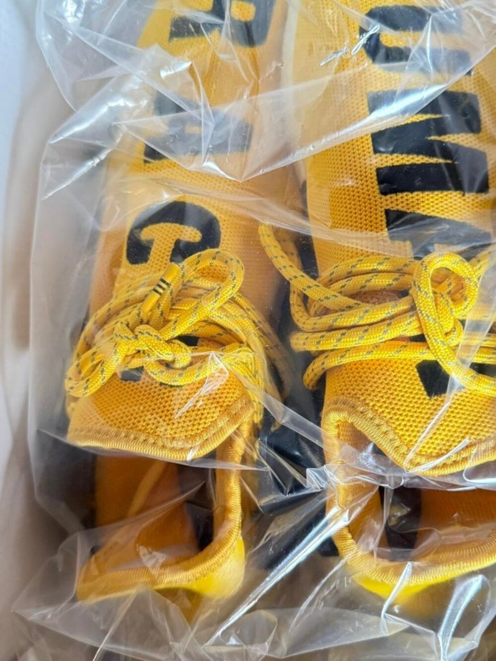 Yellow and black Adidas Pharrell Human Race trainers #PharrellCollab